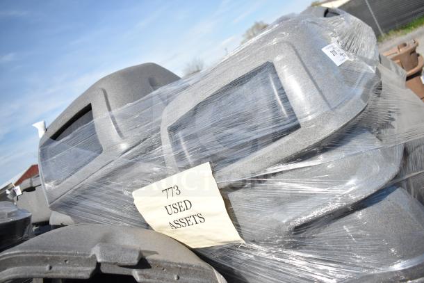 5 gray poly trash cans with extra lids wrapped in plastic. Label reads "773 USED ASSETS." Durable and in used condition.