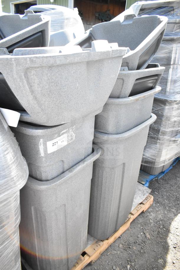 Eight gray poly trash cans on a pallet, durable design, label reads "221". Ideal for bulk waste management.