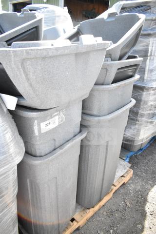 Eight gray poly trash cans on a pallet, durable design, label reads "221". Ideal for bulk waste management.