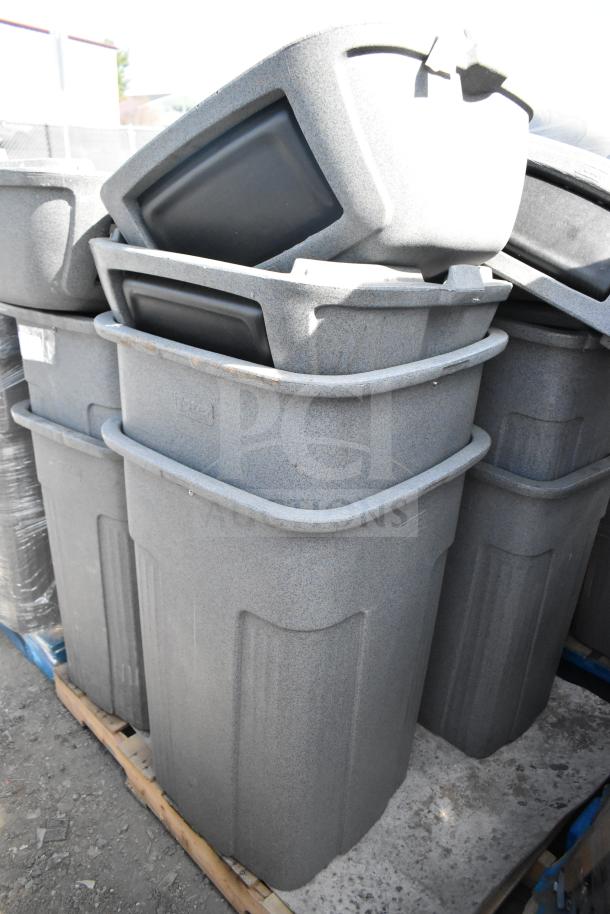 Gray poly trash cans stacked, eight units. Durable construction, suitable for commercial use. Auctioned in bulk, enhancing value.