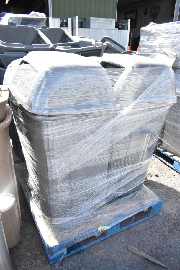 Four gray poly trash cans shrink-wrapped on a blue pallet, in new condition, multiple times bid offer visible.