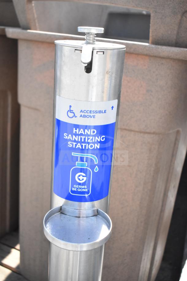 Stainless steel hand sanitizing station labeled "Germs Be Gone," with accessible height indicator.