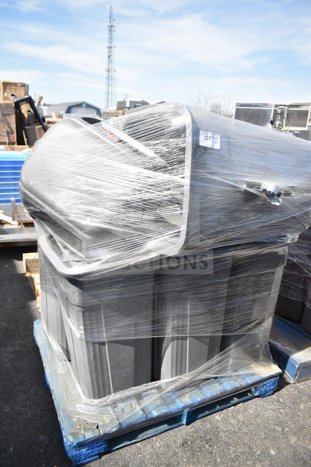 Six gray poly trash cans wrapped in plastic on a pallet. Auction tag marked "227" visible. New condition.