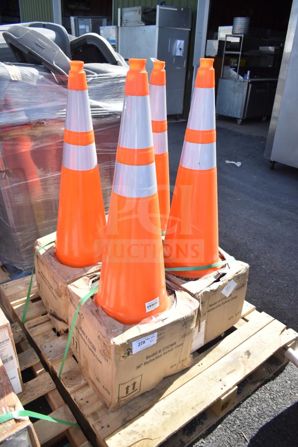 4 new Boen CTC36R orange PVC traffic cones, 36 inches, reflective, on pallets, box labeled "scratch and dent."