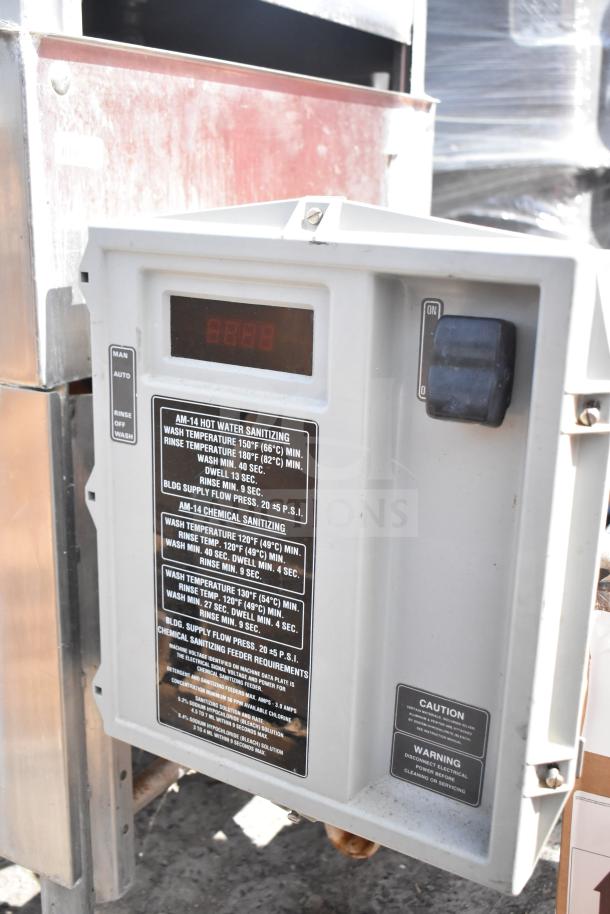 Hobart AM-14 commercial pass through dishwasher control panel with temperature and cycle instructions visible.