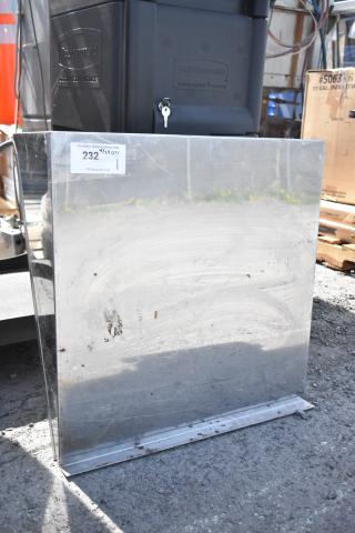 Stainless steel wall mount shelf with visible surface marks, auction tag number 232, reflective finish, suitable for storage.