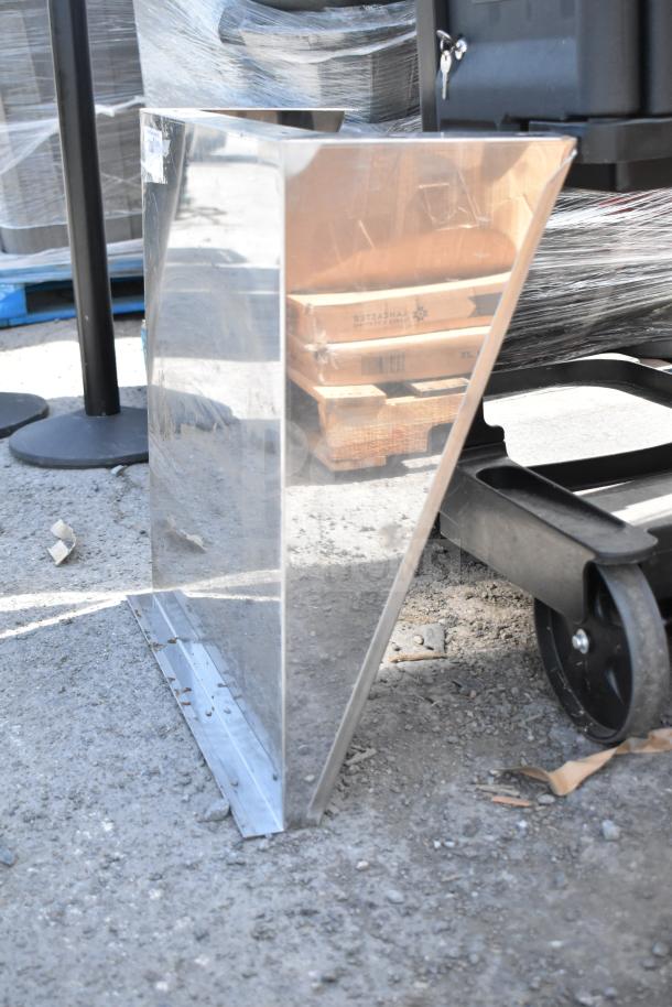 Stainless steel wall mount shelf, rectangular with mounting bracket, in used condition, showing surface reflections.