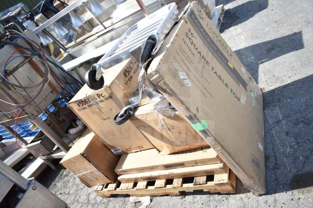 New scratch and dent items including a 17-gal industrial tote, Excalibur 36" square tabletop, and pan rack stacked on pallet.
