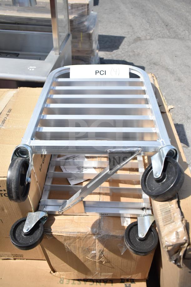 Stainless steel pan rack on casters, brand new with minor scratches and dents. Includes label "PCI" and is part of a 7-item lot.