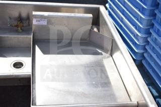 Stainless steel left side clean side dishwasher table, no legs, with faucet and drain. Auction tag shows item 235.