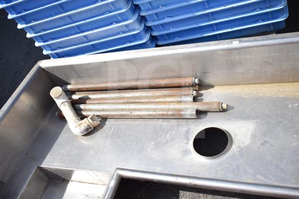 Right Side Dirty Side Dishwasher Table with rusted pipes and a PVC connector. Scratched surface indicates used condition.