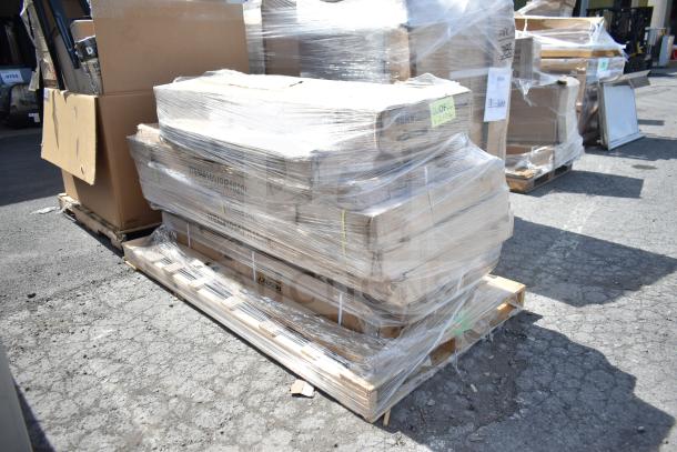 Plastic-wrapped pallets with brand new scratch and dent items, including table, strip warmer, and pan rack. Auction lot APR26-91.