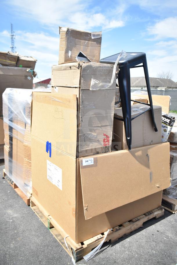 Cardboard boxes on pallet with scratch and dent items including a stool and sink; visible labels and packaging.