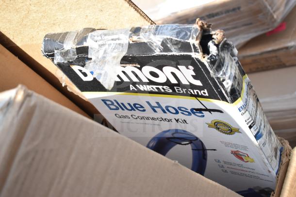 Damaged box of Dormont Blue Hose Gas Connector Kit, a Watts Brand, showing wear and tape repairs.