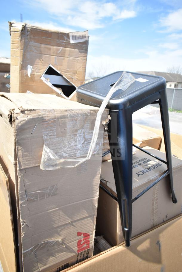 Brand new scratch and dent items, including a black metal stool. Boxes show damage. Great value for auction bids.