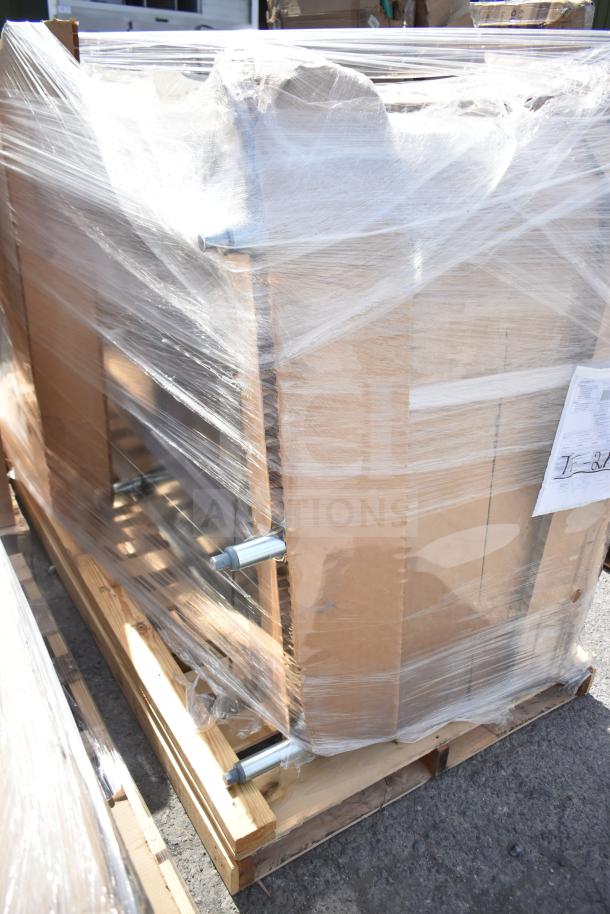 Brand new item with scratch and dent, wrapped in plastic on a pallet. Visible metal parts and cardboard packaging.