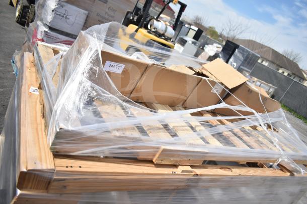 Three brand new scratch and dent items including a sink, wrapped on a pallet; visible labels and packaging.