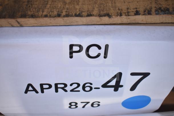 "PCI" label on wooden crate, auction item APR26-47, includes three new items with minor scratches and dents, one is a sink.