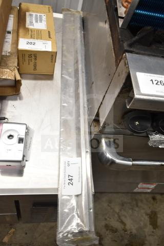 Brand new TR36 Ticket Rack in packaging, stainless steel, visible label with quantity 247.