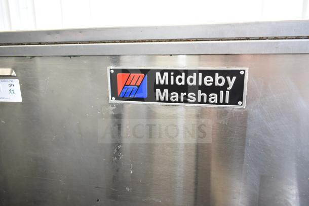2021 Middleby Marshall PS638G conveyor pizza oven, natural gas powered, 89,000 BTU, commercial casters, model label visible.