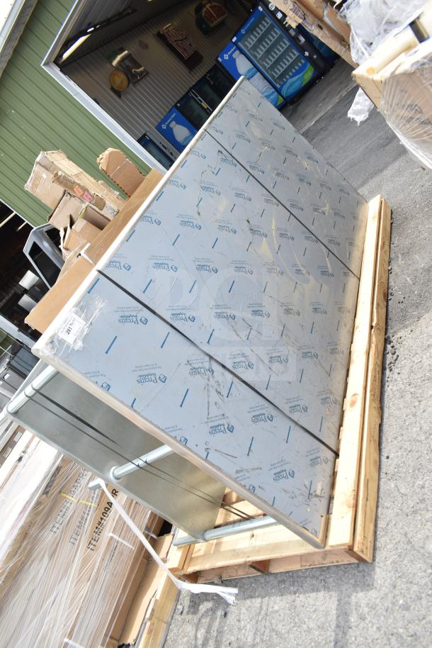 BRAND NEW UG-488 stainless steel table with under shelf, scratch and dent condition. Protective film partially visible.