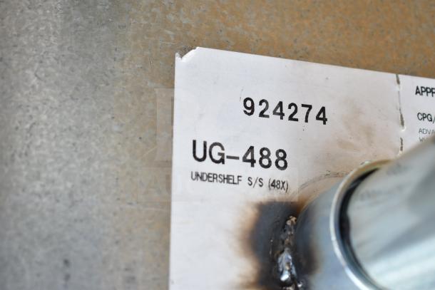 Label on UG-488 stainless steel table with under shelf. Model and serial number visible. Scratch and dent condition.