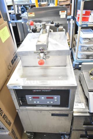 2023 Henny Penny 600 pressure fryer, natural gas, 80,000 BTU, commercial casters, digital controls, clean condition.