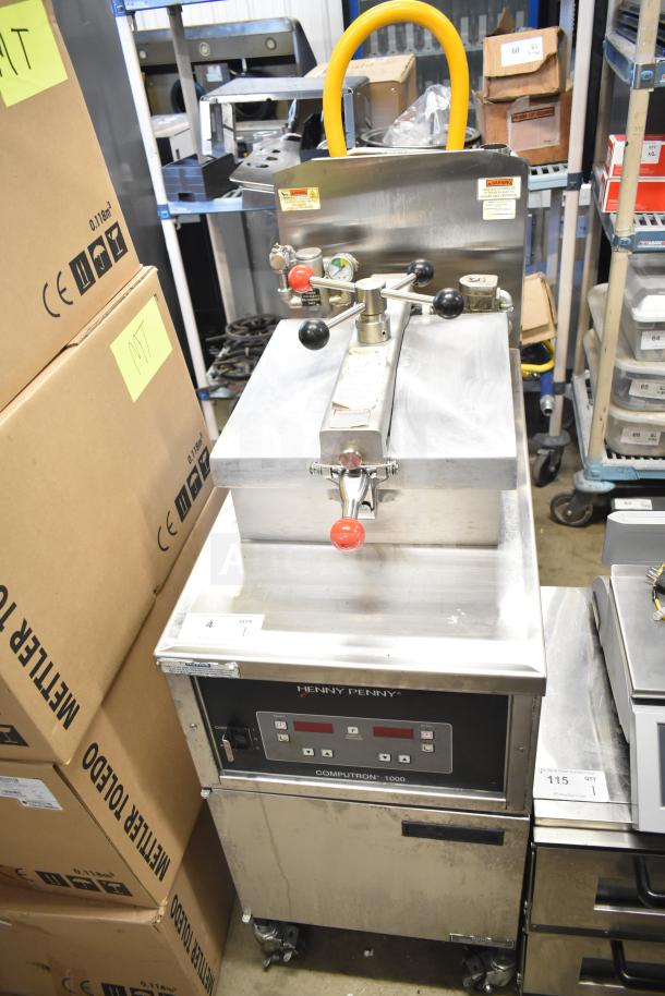 2023 Henny Penny 600 pressure fryer, commercial floor style, natural gas powered, 80,000 BTU, on casters, with control panel.