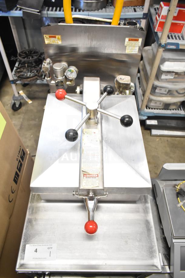 2023 Henny Penny 600 gas-powered pressure fryer, 80,000 BTU, on commercial casters. Features temperature gauge and warning labels.