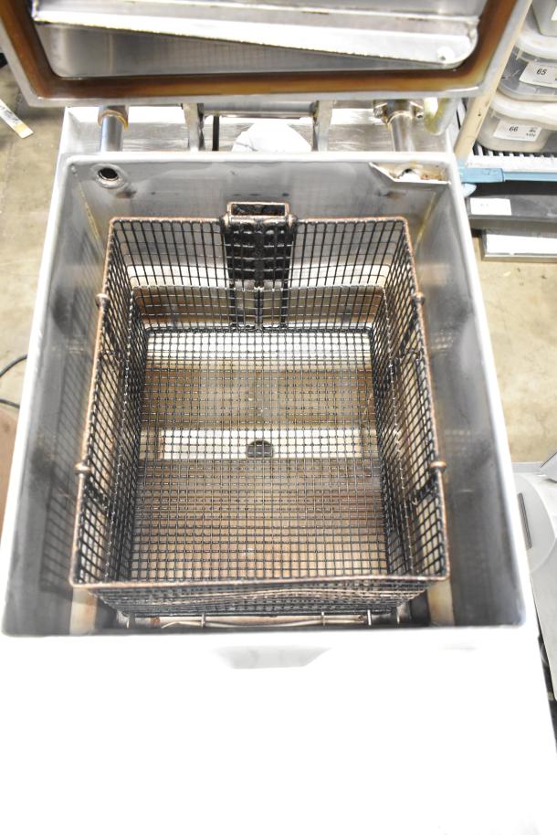 2023 Henny Penny 600 pressure fryer, commercial floor style, natural gas, 80,000 BTU, on casters, clean condition.