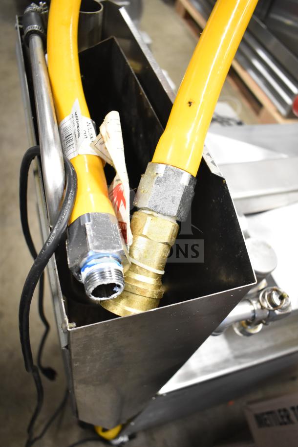 2023 Henny Penny 600 commercial pressure fryer, natural gas, on casters, 80,000 BTU. Fresh condition, hoses and fittings shown.