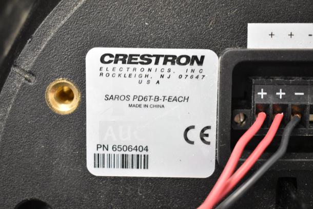 Label on Crestron SAROS PD6T-B-T-EACH speaker showing model details, part number 6506404, and wiring setup.