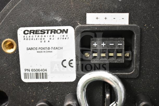 Rear view of a Crestron SAROS PD6T-B-T-EACH speaker showing connection panel and label with part number and CE marking.