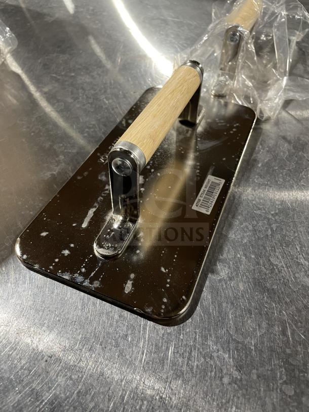 Brand new VollRath 47703 commercial stainless steel steak weight with wood handle, includes barcode label.