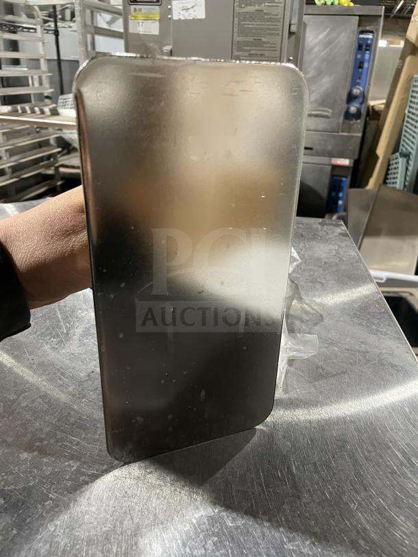 Brand new VollRath 47703 commercial steak weight with stainless steel plate and sturdy wood handle.