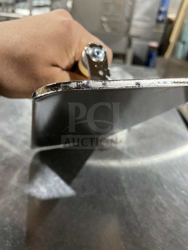 Brand new VollRath stainless steel steak weight, model 47703, with wood handle. Ideal for commercial use.