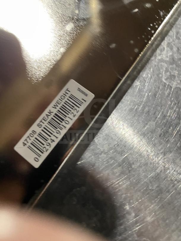 BRAND NEW VollRath Commercial Stainless Steel Steak Weight, Model 47703, with wood handle and visible barcode.