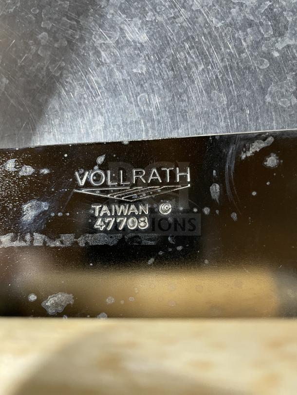 VollRath stainless steel steak weight, Model 47703, with wood handle. Brand markings visible. New condition.