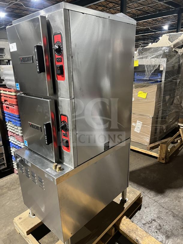 Brand new Vulcan C24ET10 stainless steel dual compartment convection steamer cabinet on legs, with individual controls and built-in pan rack.