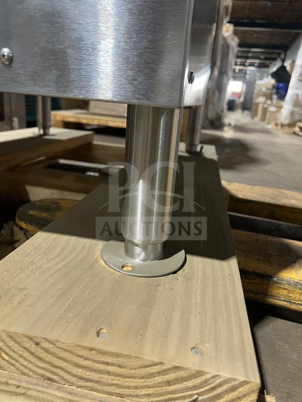 Alt text: Vulcan C24ET10 stainless steel convection steamer cabinet leg. On wooden platform in warehouse. New condition.