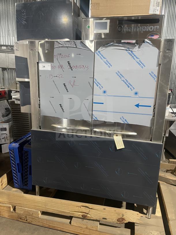 Champion 44PRO stainless steel high temperature conveyor dishwasher, new, with full-size dish rack and built-in booster, on legs.