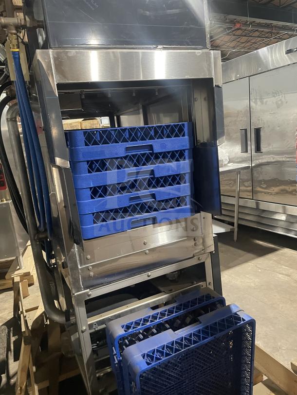 Champion 44PRO stainless steel high-temp conveyor dishwasher, new, with full-size dish racks and built-in booster, on legs.