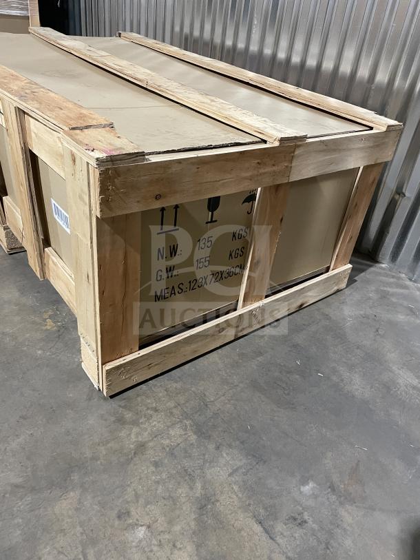 Cookline CGG24M commercial gas griddle in crate. Stainless steel, manual controls, with back & side splash. New condition.