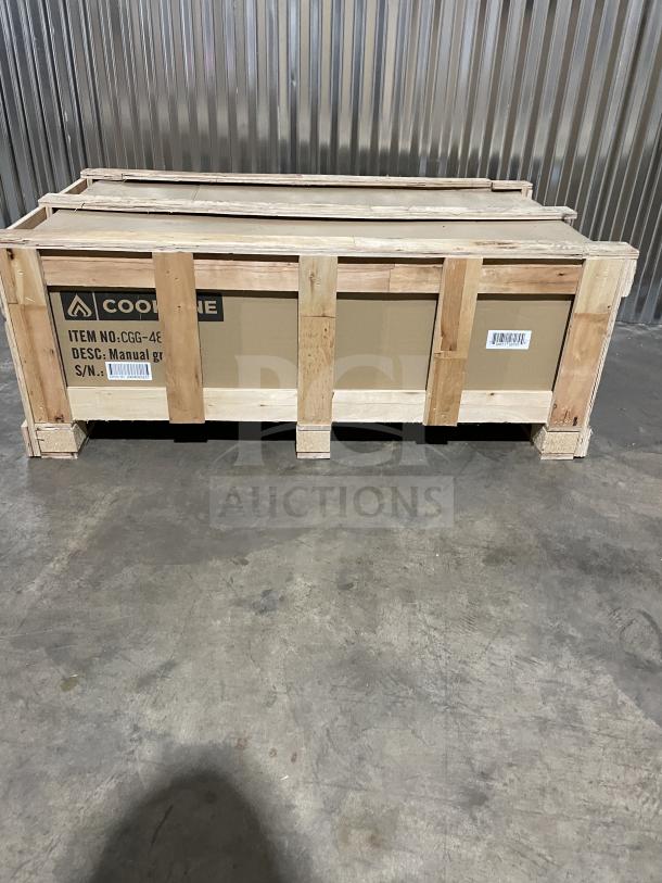 Brand new Cookline CGG48M stainless steel gas griddle, manual controls, with back and side splash, crated for shipping.