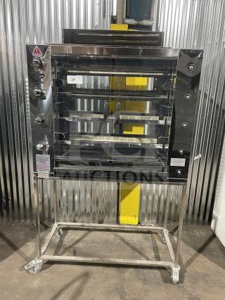 Brand new Rotisol 1160.4 stainless steel gas rotisserie oven with tempered glass doors and casters. Model SN: 9409.