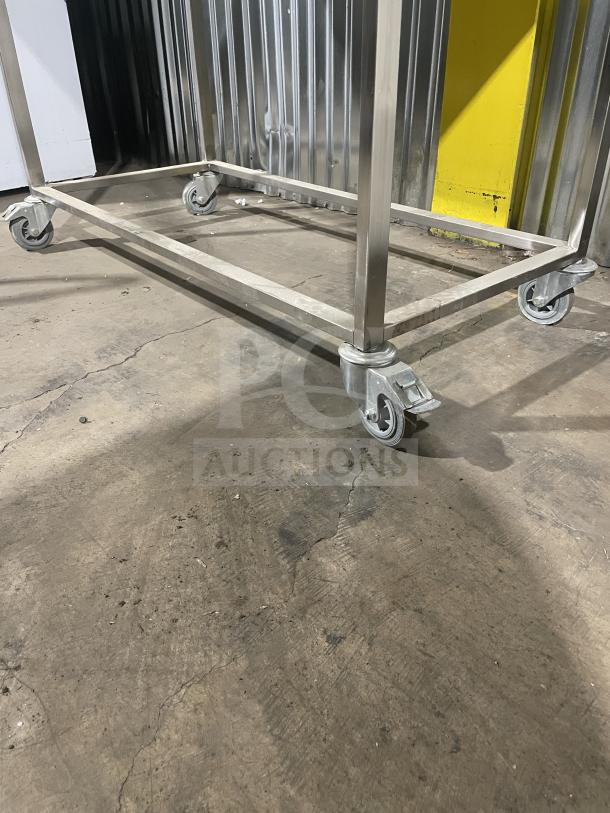 Commercial stainless steel rotisserie oven with casters by Rotisol, model 1160.4. Brand new condition.