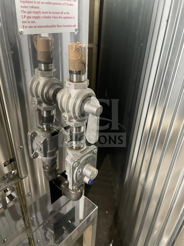 Rotisol stainless steel natural gas rotisserie oven, model 11604, brand new with tempered glass doors and casters.