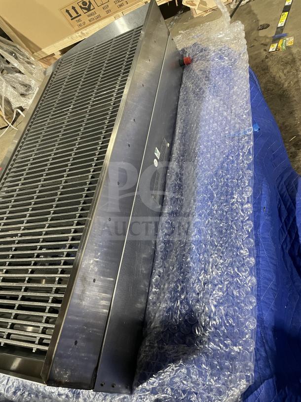 BRAND NEW Star Max Series Gas Char Broiler with stainless steel, cast iron grates, and back and side splash. On legs.