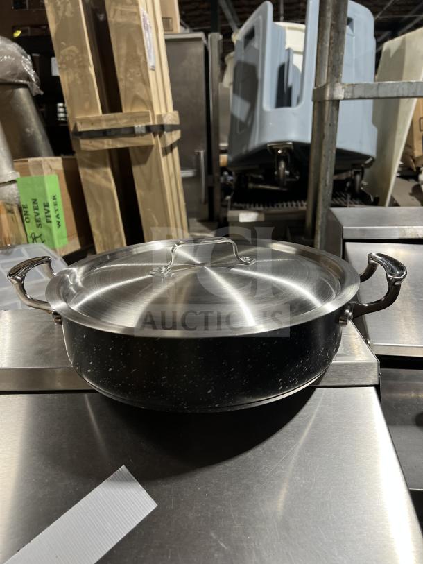 Bon Chef black 6 Qt sauté pot, brand new in box, with stainless steel lid, interior, and handles.