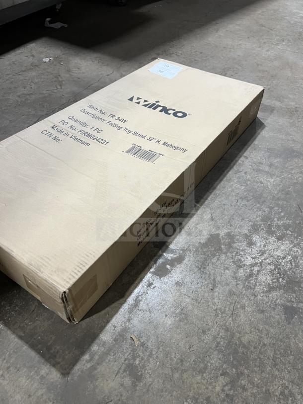 Brand new Winco TR-34W mahogany 32” folding tray stand in box. Box labeled with item details and origin: Vietnam.